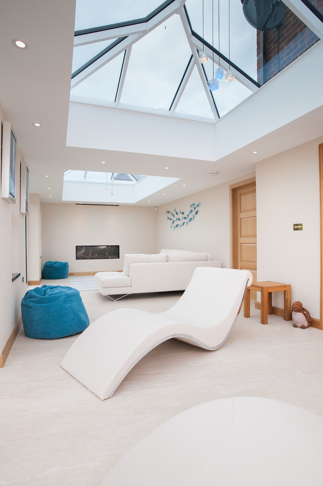 This is an example of a contemporary family room in Gloucestershire.