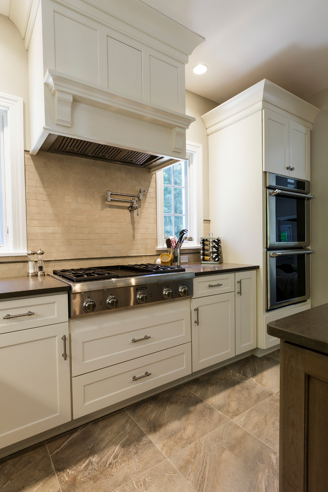 Open concept kitchen - mid-sized rustic l-shaped porcelain tile and beige floor open concept kitchen idea in Bridgeport with an undermount sink, shaker cabinets, white cabinets, granite countertops, beige backsplash, porcelain backsplash, stainless steel appliances and an island