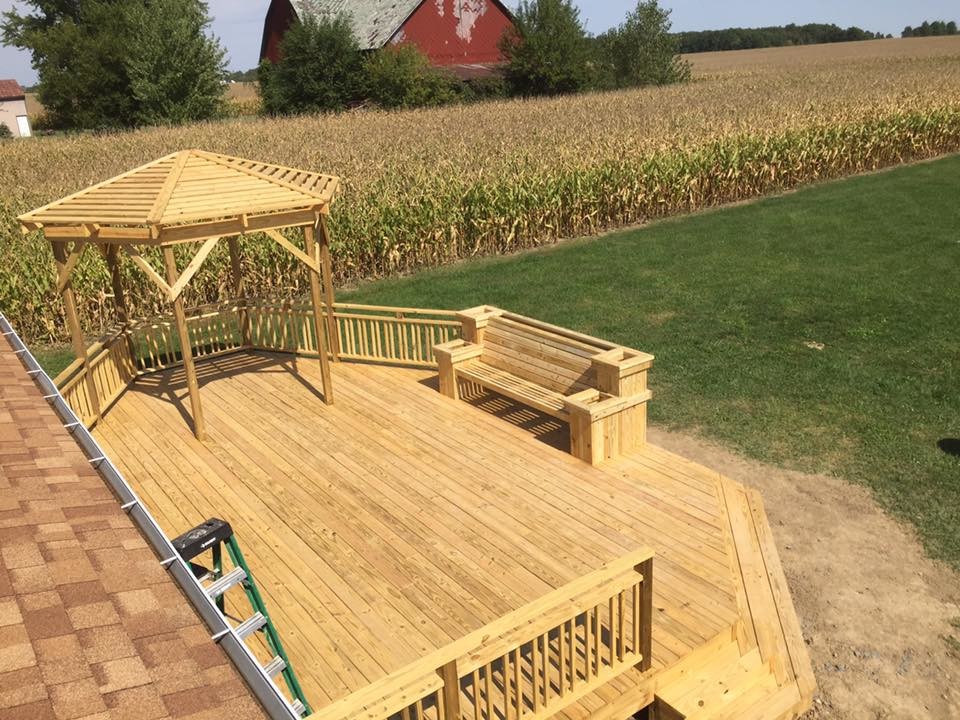Inspiration for a mid-sized backyard deck remodel with a pergola