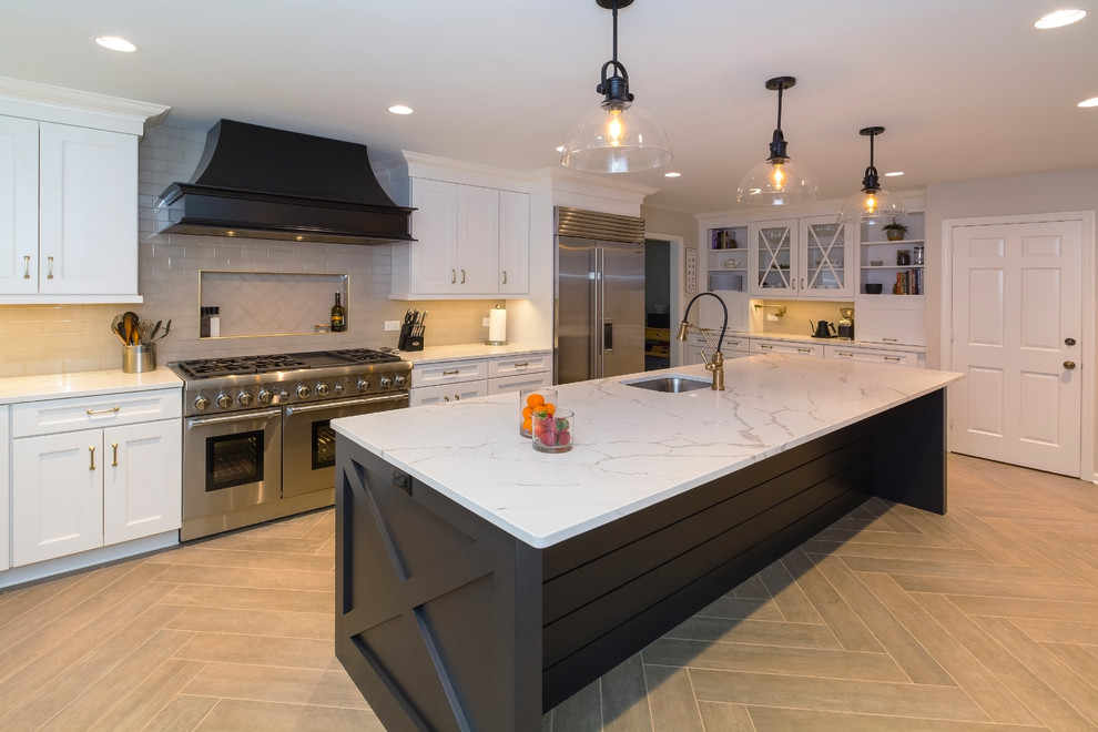 Transitional brown floor kitchen photo with an island