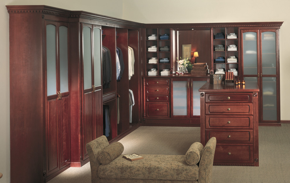Photo of a large traditional men's walk-in wardrobe in Los Angeles with medium wood cabinets and recessed-panel cabinets.