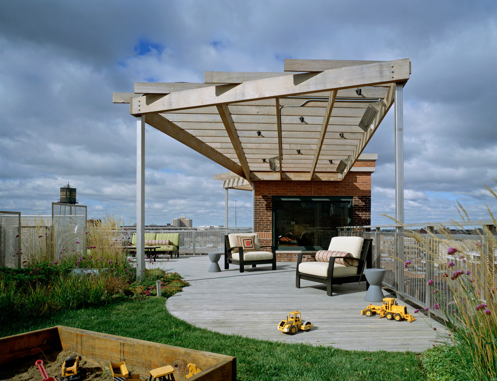 This is an example of a contemporary rooftop and rooftop deck in Chicago with a pergola.