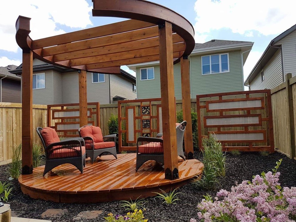 This is an example of a contemporary backyard deck in Edmonton with no cover.