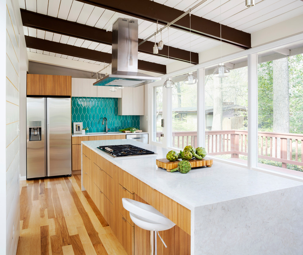 Design ideas for a midcentury kitchen in DC Metro with flat-panel cabinets, light wood cabinets, blue splashback, stainless steel appliances, light hardwood floors, with island, beige floor, white benchtop, exposed beam, timber and vaulted.