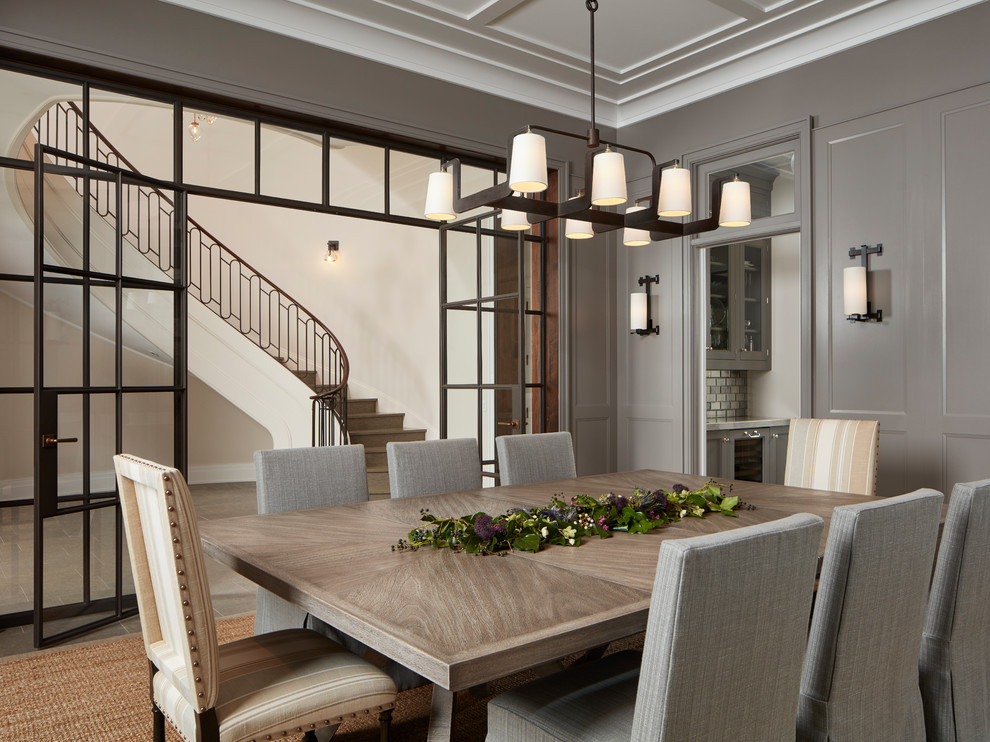 Design ideas for an expansive traditional separate dining room in Chicago with grey walls, limestone floors, no fireplace and grey floor.