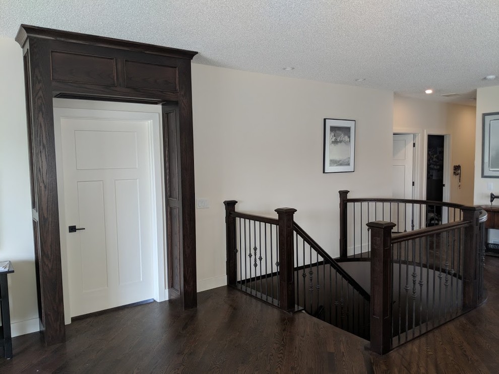 Inspiration for a mid-sized timeless wooden curved mixed material railing staircase remodel in Calgary