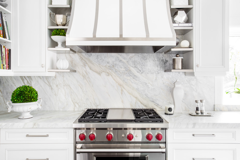 Example of a large transitional l-shaped dark wood floor and brown floor enclosed kitchen design in Toronto with a double-bowl sink, recessed-panel cabinets, white cabinets, quartzite countertops, gray backsplash, stainless steel appliances, an island, white countertops and stone slab backsplash