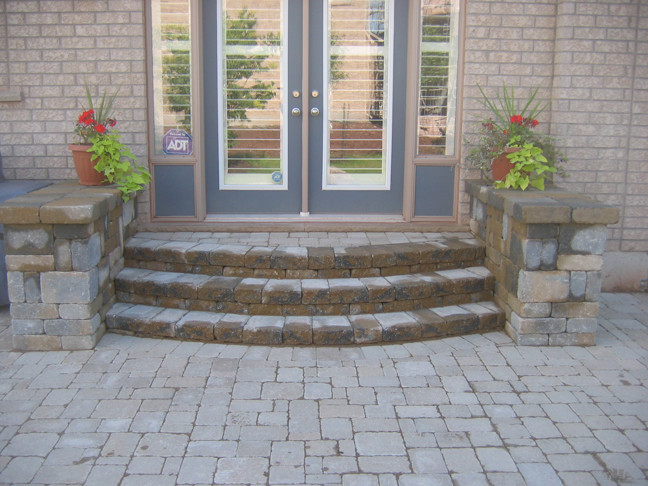 This is an example of a transitional backyard brick landscaping in Toronto.