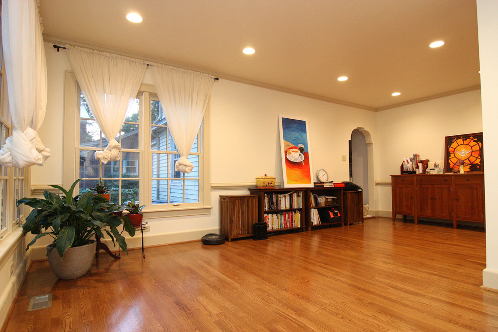 Example of a large transitional light wood floor home design design with a standard ceiling