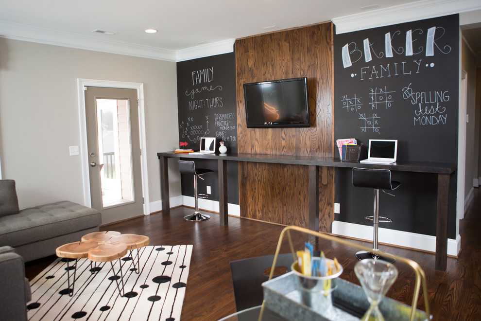 This is an example of a large transitional gender-neutral kids' room in Raleigh with grey walls and dark hardwood floors.