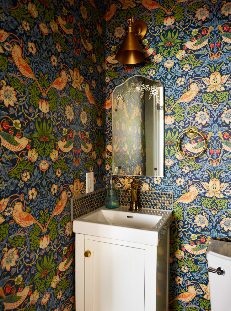 Inspiration for a small traditional cloakroom in Boston with shaker cabinets, white cabinets, a one-piece toilet, multi-coloured walls, brick flooring, a wall-mounted sink, solid surface worktops, red floors, white worktops, a built in vanity unit and wallpapered walls.