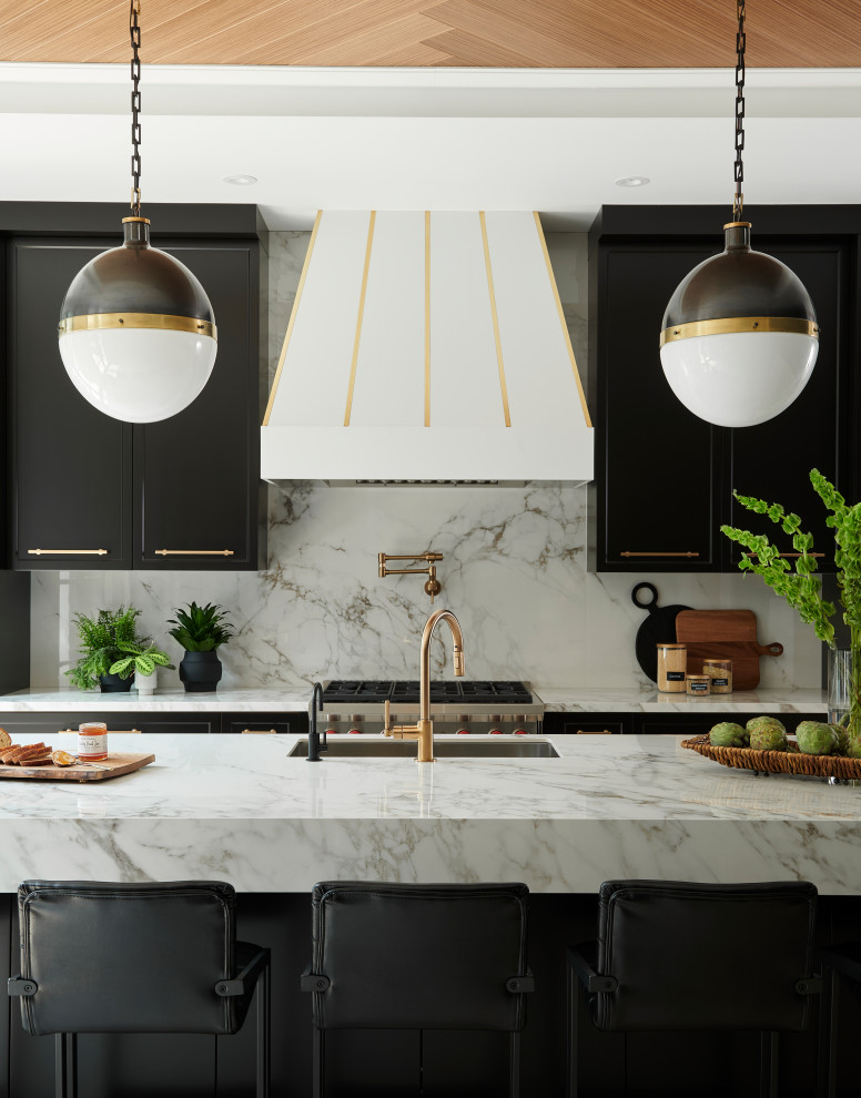 Inspiration for a large contemporary l-shaped open plan kitchen in Toronto with a double-bowl sink, shaker cabinets, black cabinets, marble benchtops, white splashback, marble splashback, panelled appliances, light hardwood floors, with island, white benchtop and recessed.