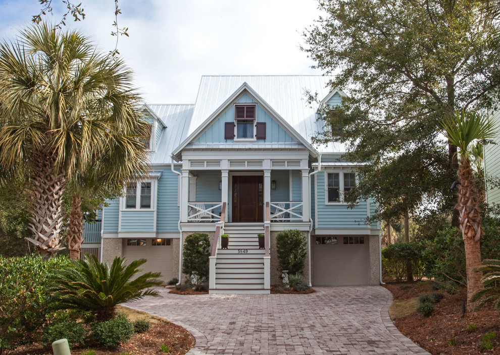 Inspiration for a large beach style two-storey exterior in Charleston.