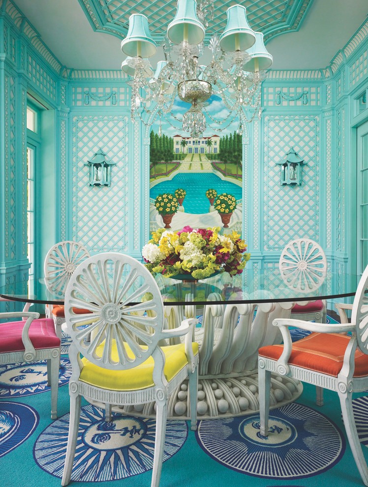 Photo of a tropical separate dining room in Miami with no fireplace and blue walls.