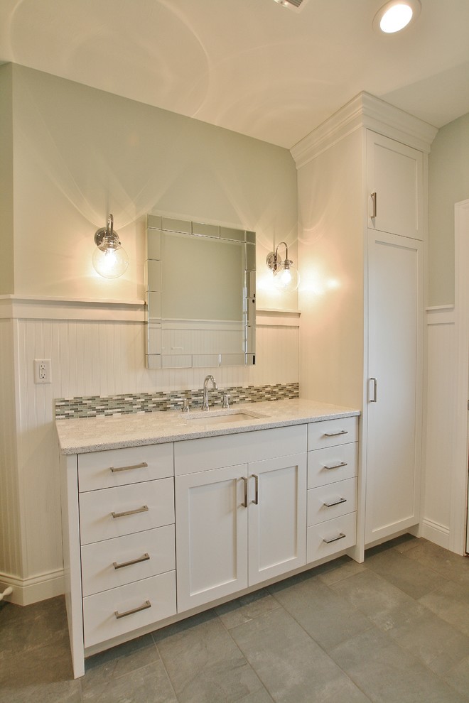 Transitional bathroom photo with flat-panel cabinets, white cabinets and quartz countertops