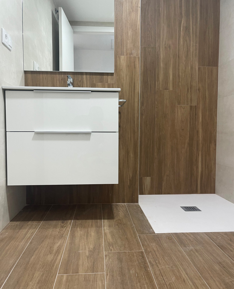 Mid-sized transitional white tile and ceramic tile dark wood floor and brown floor powder room photo in Valencia with beaded inset cabinets, white cabinets, a bidet, brown walls, a wall-mount sink, marble countertops, white countertops and a freestanding vanity