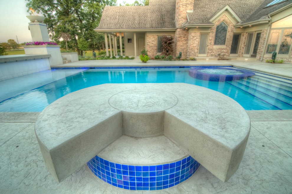 Inspiration for a large transitional backyard concrete paver and rectangular natural hot tub remodel in Cedar Rapids