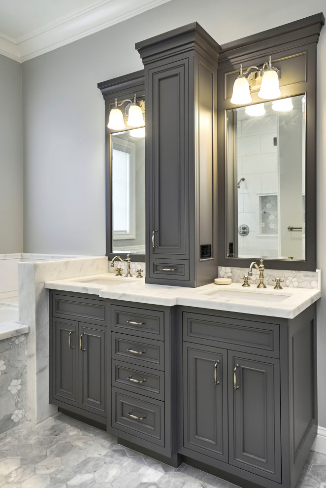 Large traditional master bathroom in San Francisco with beaded inset cabinets, grey cabinets, a drop-in tub, an alcove shower, a two-piece toilet, gray tile, marble, grey walls, marble floors, an undermount sink, marble benchtops, grey floor, a hinged shower door, white benchtops, a niche, a double vanity and a built-in vanity.