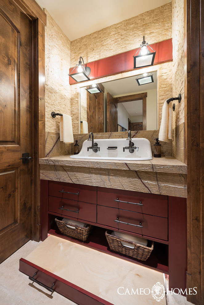 Inspiration for a small country bathroom in Salt Lake City with a trough sink, marble benchtops, flat-panel cabinets, dark wood cabinets, beige tile, stone tile, white walls and porcelain floors.