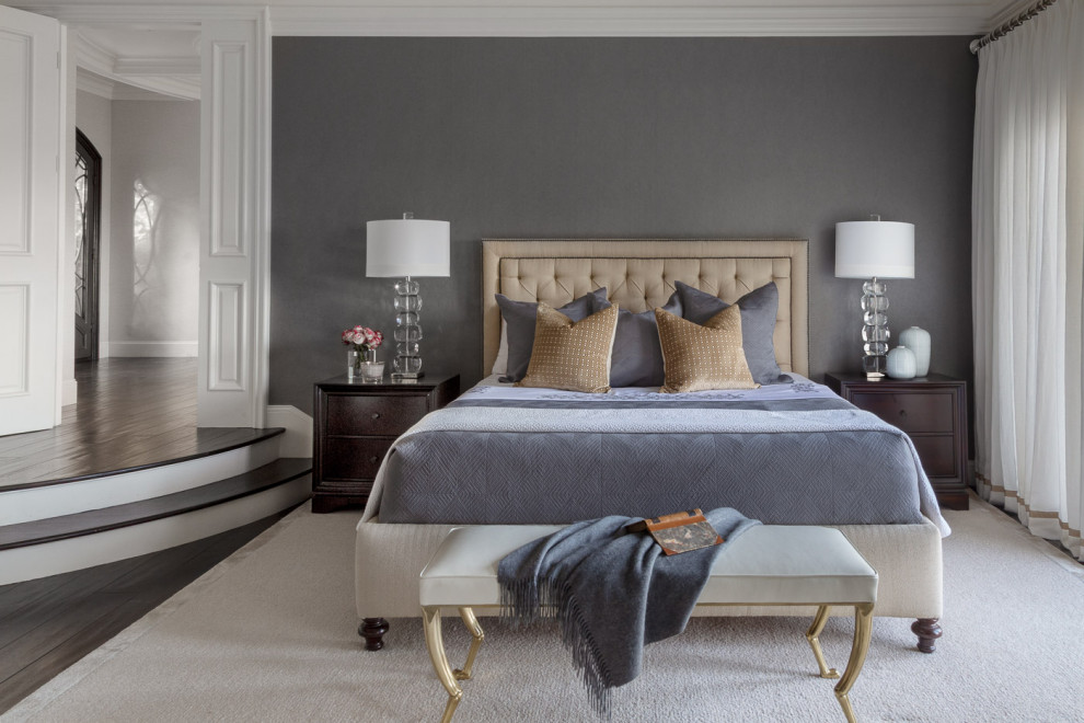 This is an example of a transitional bedroom in San Francisco with grey walls, dark hardwood floors and brown floor.