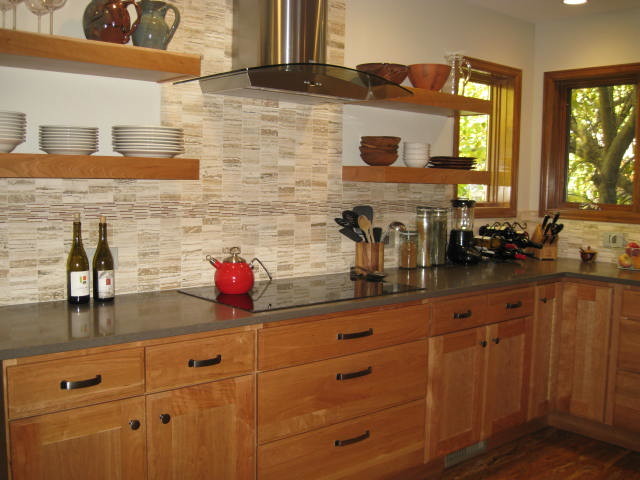 Example of a medium tone wood floor kitchen design in Denver with medium tone wood cabinets and beige backsplash