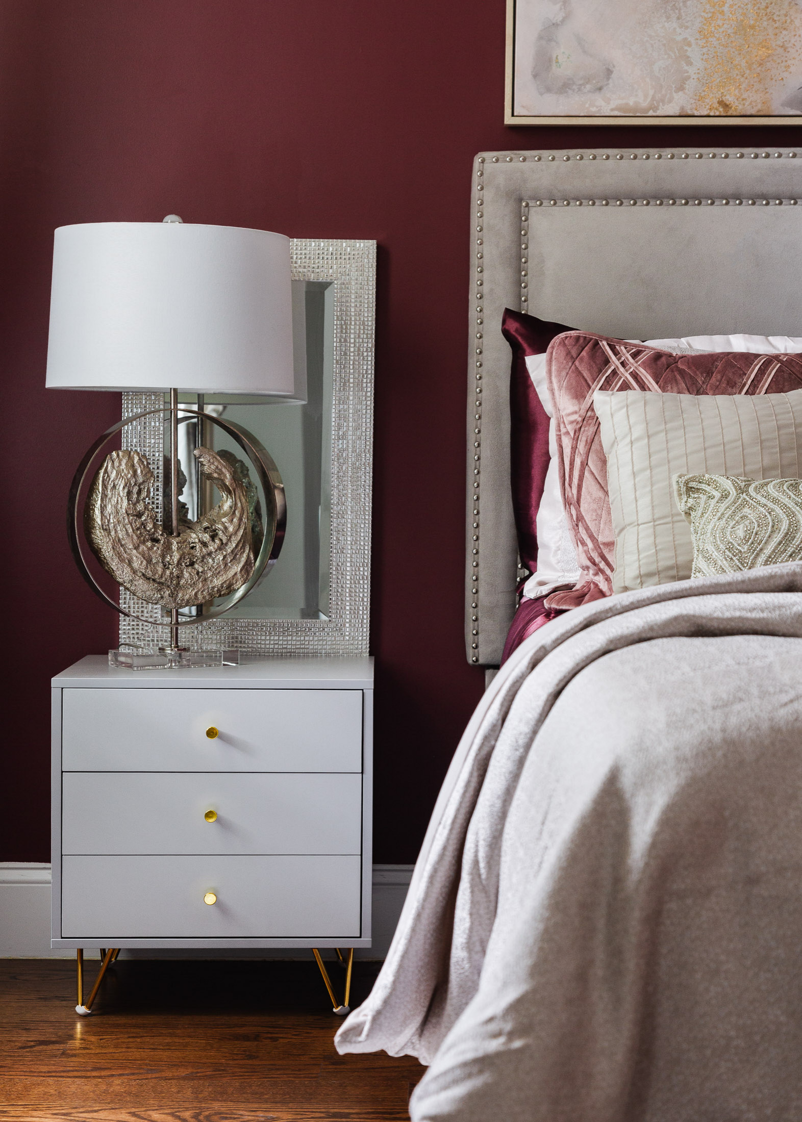 The "Chic Rose Master Suite" was a master bedroom that was for a single mom of twin girls who wanted a space that was her oasis. We created a mature yet elegant design by playing with deep color tones