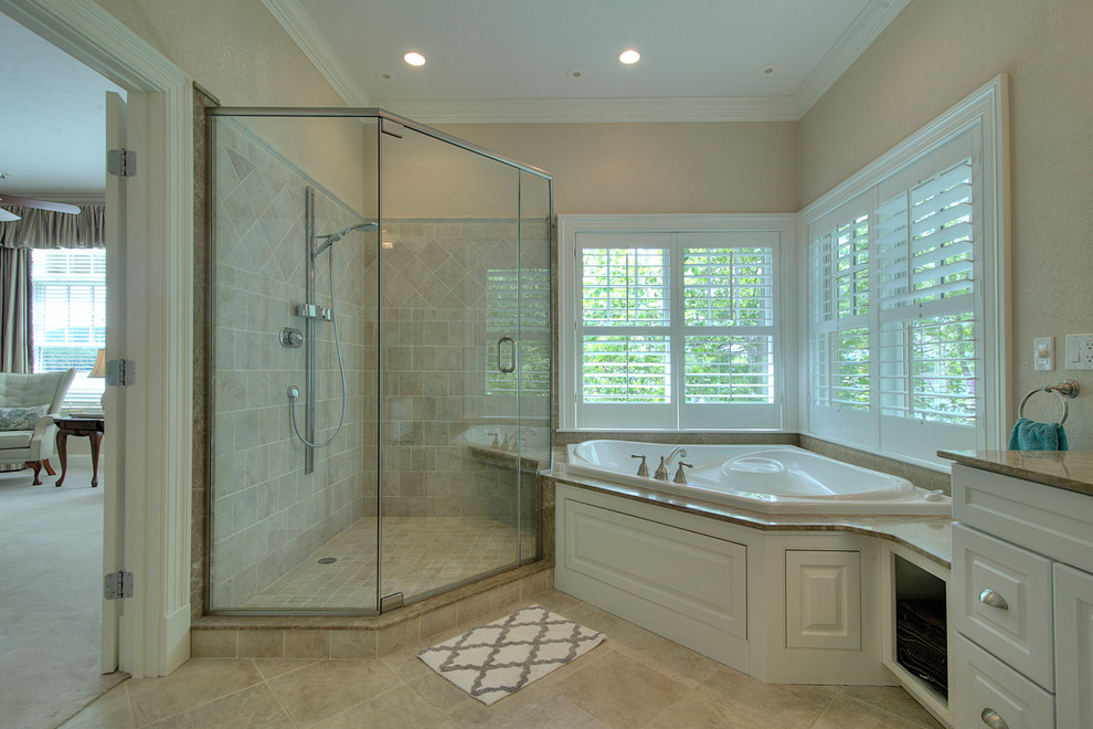 Photo of a large arts and crafts master bathroom in Portland Maine with an integrated sink, recessed-panel cabinets, granite benchtops, an alcove tub, a corner shower, beige tile, cement tile, beige walls, ceramic floors and white cabinets.