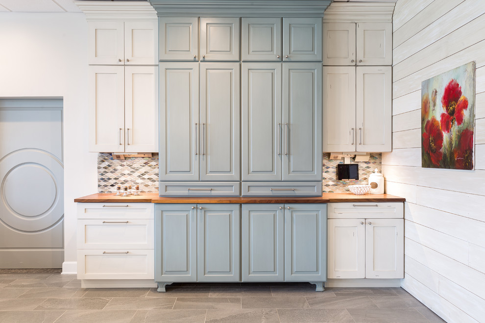 Inspiration for a large transitional porcelain tile and brown floor great room remodel with white walls and no fireplace