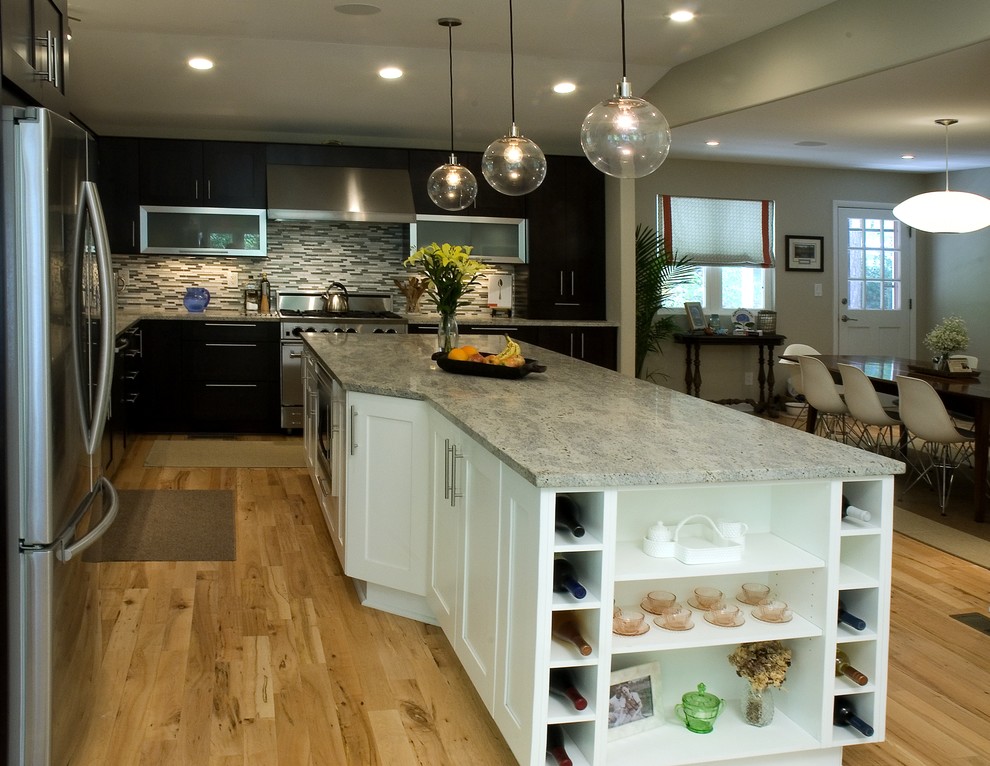Photo of a mid-sized contemporary l-shaped separate kitchen in Atlanta with an undermount sink, shaker cabinets, dark wood cabinets, granite benchtops, multi-coloured splashback, matchstick tile splashback, stainless steel appliances, medium hardwood floors, with island and beige floor.