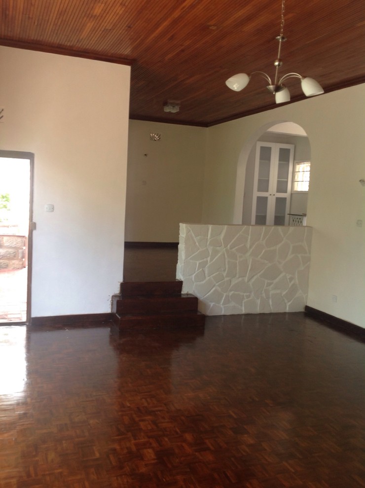Example of a mid-sized transitional medium tone wood floor kitchen/dining room combo design with white walls