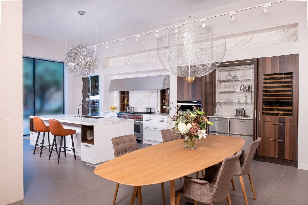 This is an example of a contemporary open plan dining room in Other with white walls and grey floors.