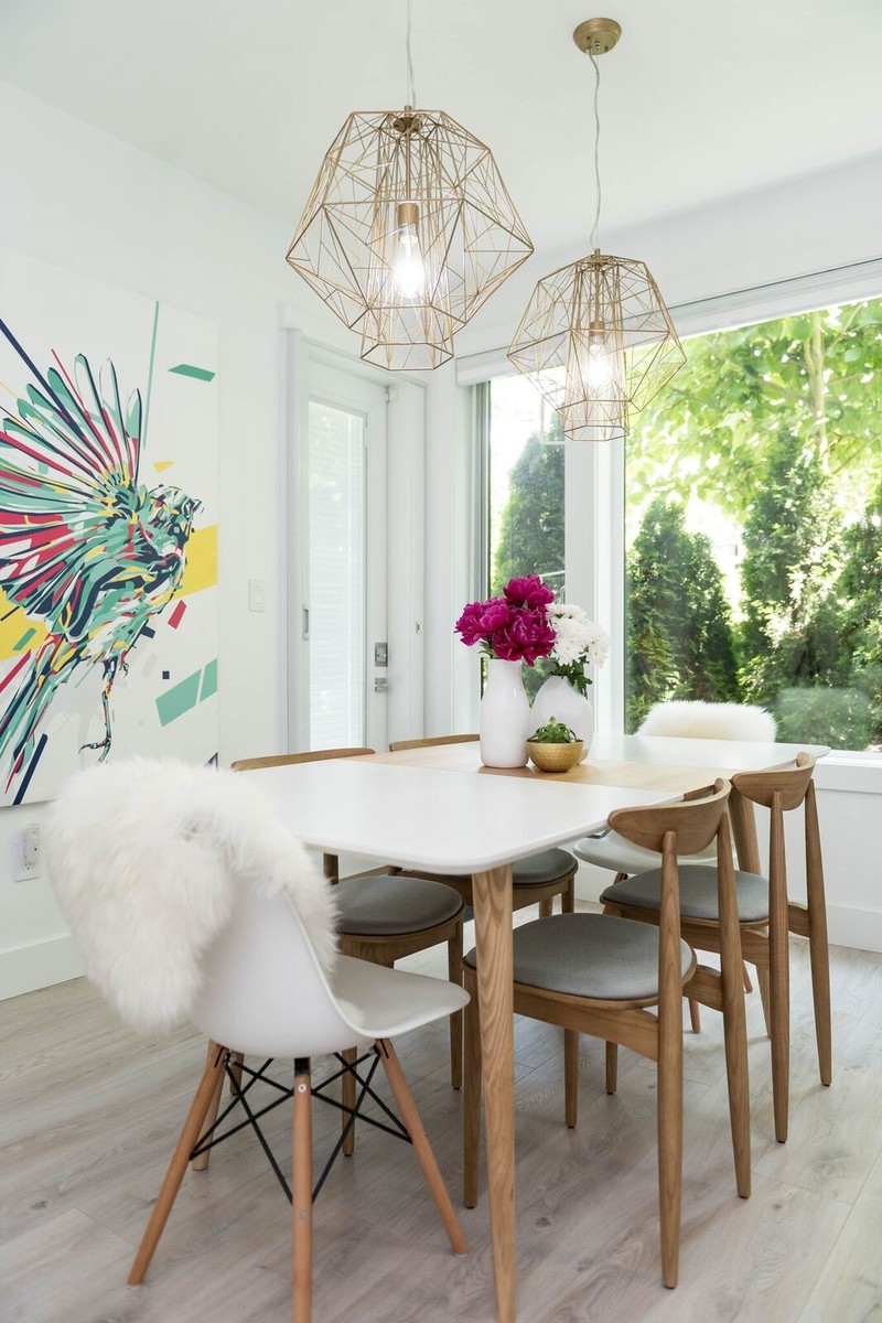 Photo of a contemporary dining room in Vancouver with white walls, light hardwood floors and grey floor.