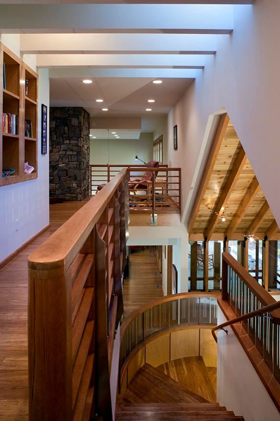 Inspiration for a mid-sized rustic medium tone wood floor and brown floor hallway remodel with white walls