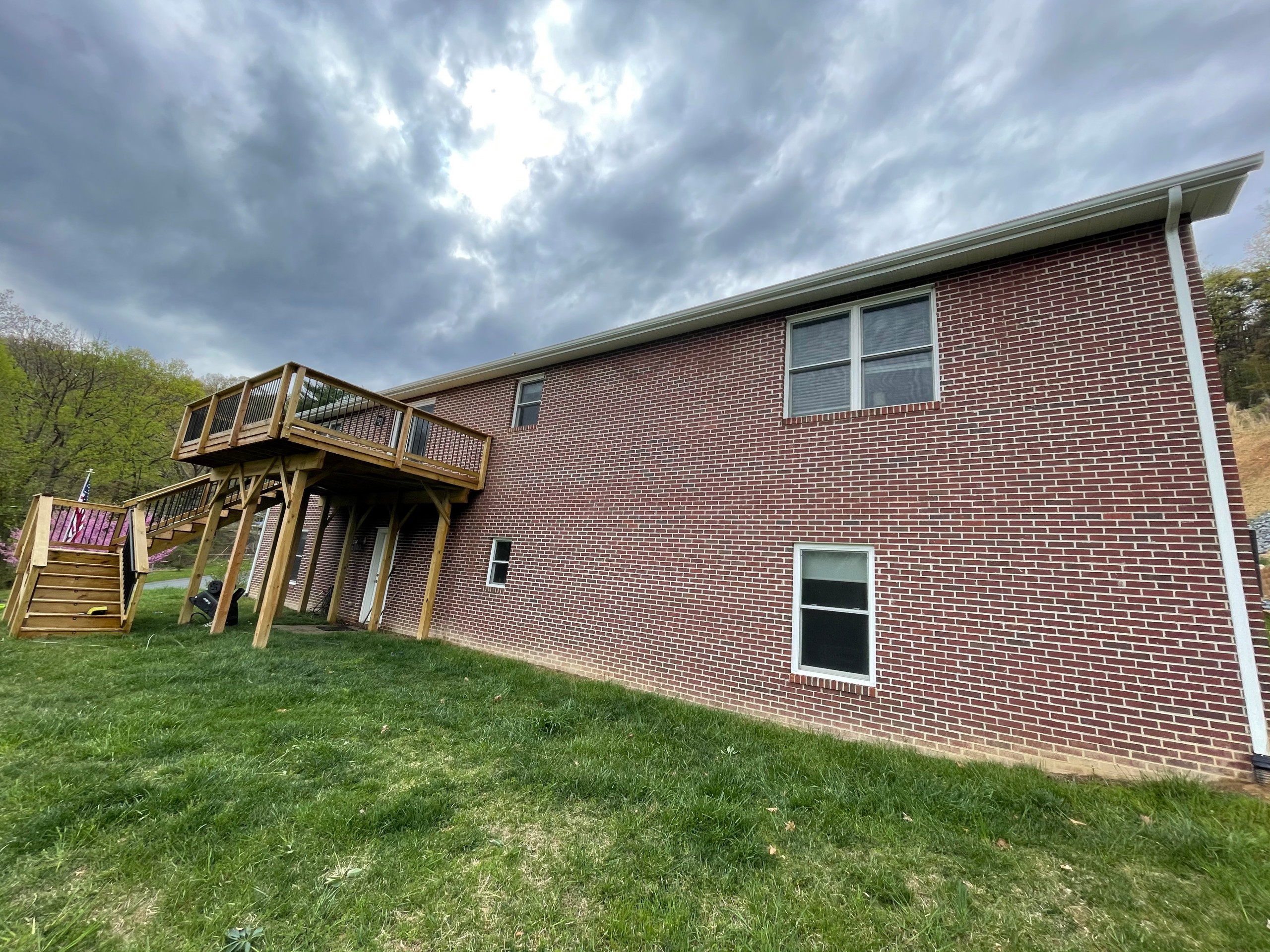 Deck stain and gutters powerwash