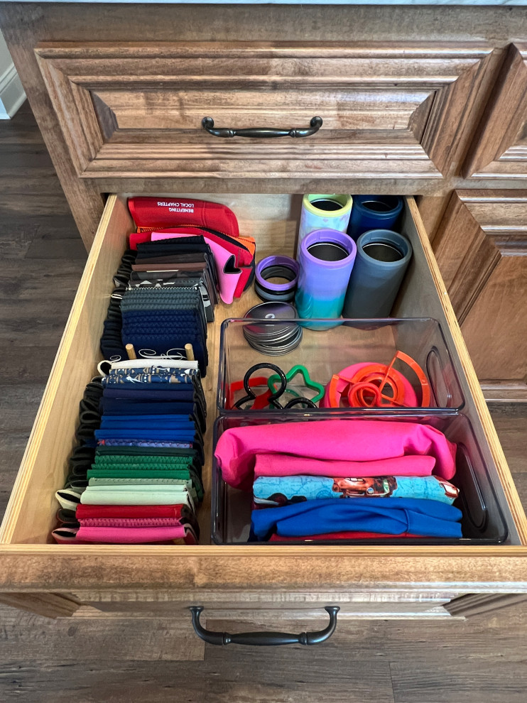 Organized Deep Kitchen drawer with koozies and sports bottles