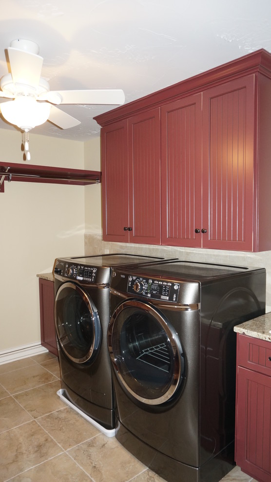 Mid-sized country dedicated laundry room in Cleveland with red cabinets, beige walls and porcelain floors.