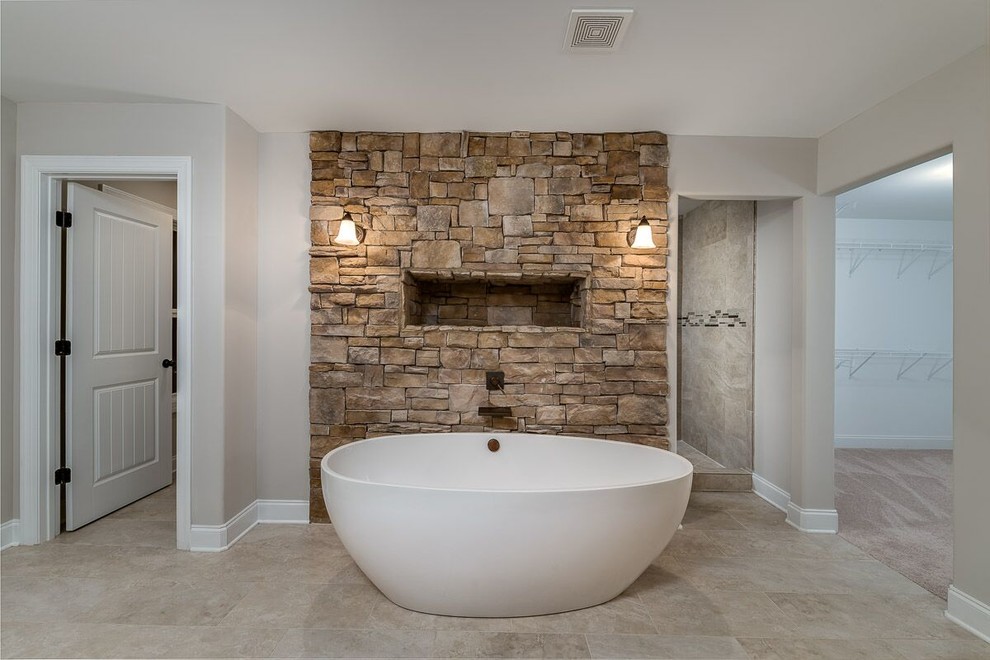 This is an example of a mid-sized arts and crafts 3/4 bathroom in Atlanta with recessed-panel cabinets, dark wood cabinets, a freestanding tub, an open shower, beige tile, stone tile, beige walls, ceramic floors, an undermount sink, granite benchtops, beige floor and an open shower.