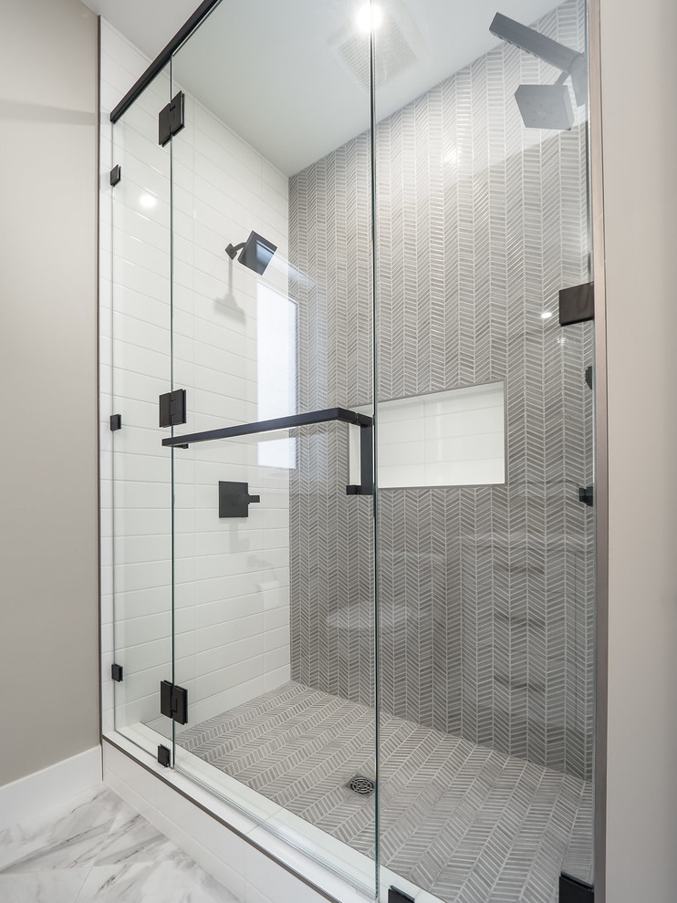 Design ideas for a mid-sized contemporary master bathroom in Edmonton with recessed-panel cabinets, white cabinets, multi-coloured tile, ceramic tile, vinyl floors, quartzite benchtops and white floor.