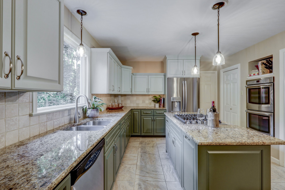 Mid-sized transitional l-shaped ceramic tile and beige floor eat-in kitchen photo with a double-bowl sink, raised-panel cabinets, green cabinets, granite countertops, beige backsplash, ceramic backsplash, stainless steel appliances, an island and beige countertops