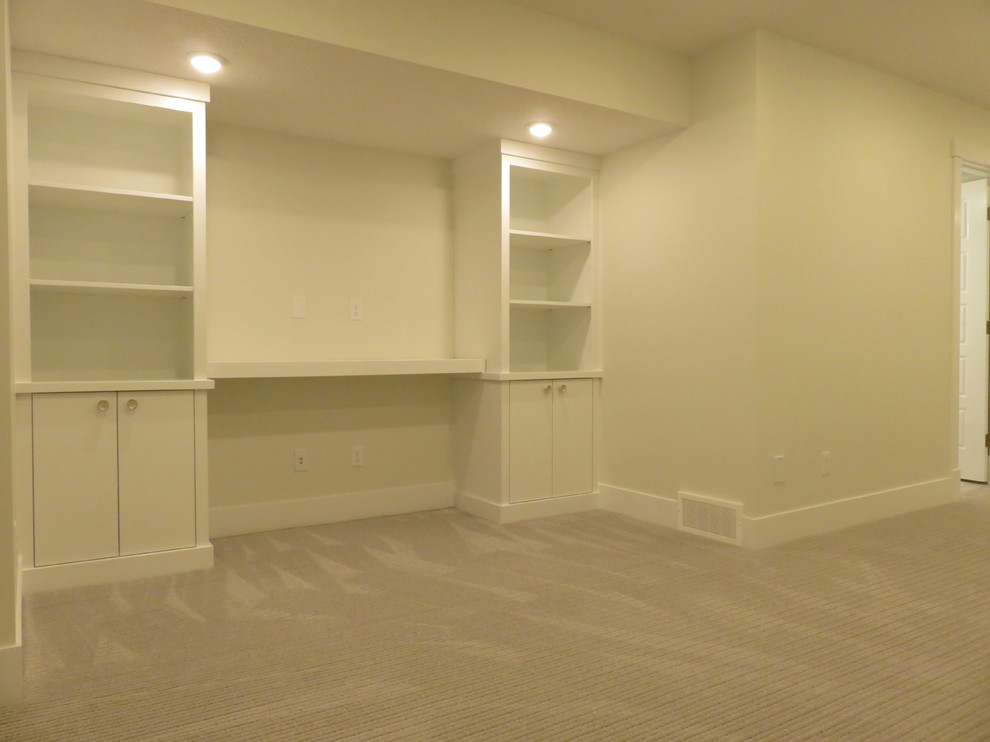 Example of a mid-sized transitional look-out carpeted and gray floor basement design in Calgary with white walls