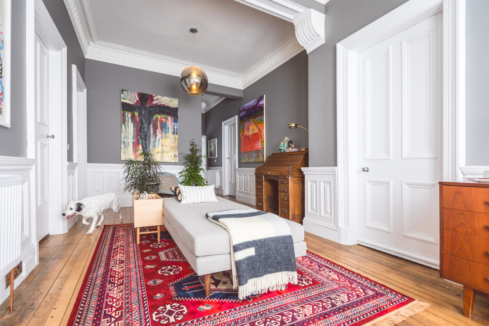 Entry hall - large eclectic medium tone wood floor entry hall idea in Glasgow