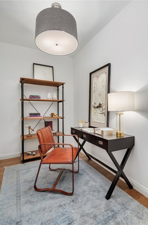 Example of a trendy home office design in New York