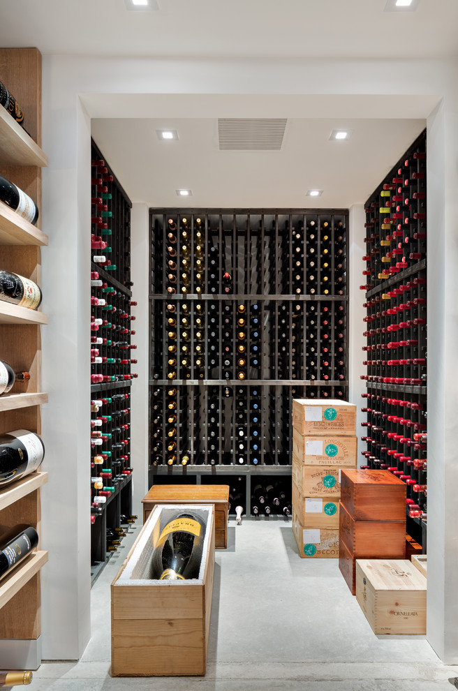 Contemporary wine cellar in New York with storage racks.