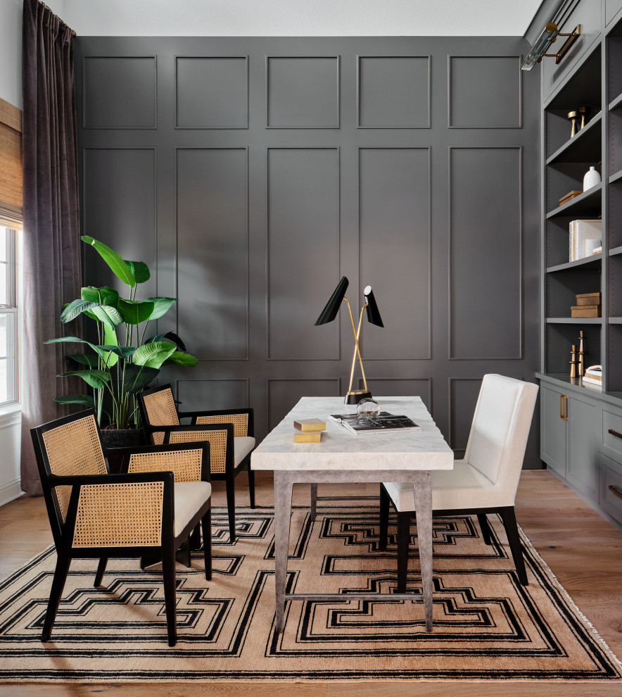 Design ideas for a mid-sized transitional study room in Austin with grey walls, light hardwood floors, a freestanding desk, grey floor, wallpaper and decorative wall panelling.