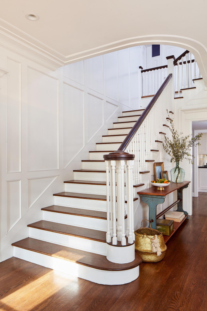 Design ideas for a traditional wood l-shaped staircase in San Francisco with painted wood risers, wood railing and panelled walls.