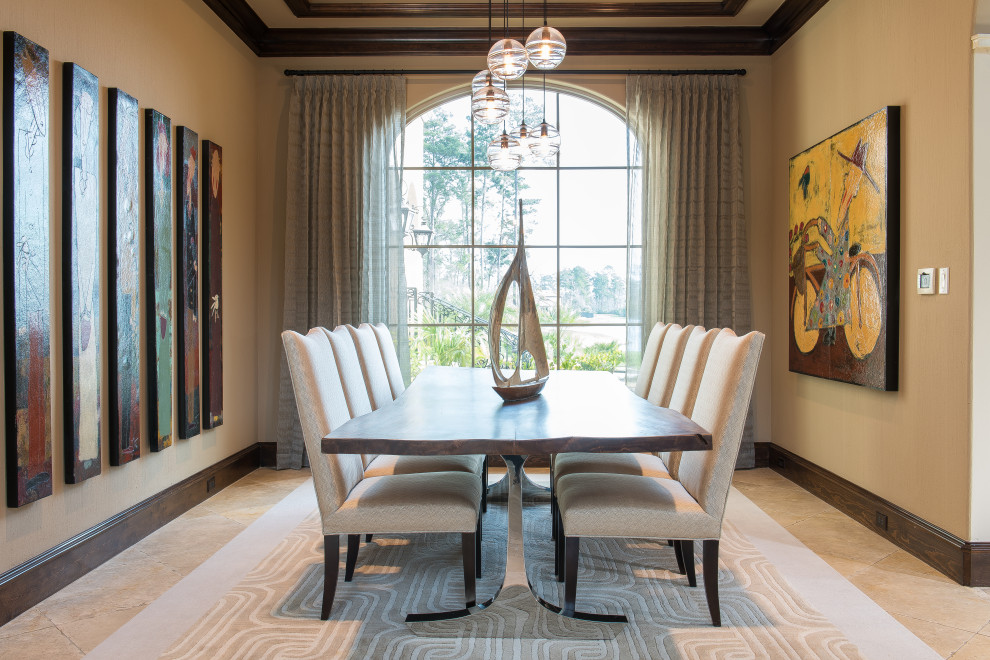 Example of a mid-sized transitional travertine floor, beige floor and tray ceiling dining room design in Houston with beige walls