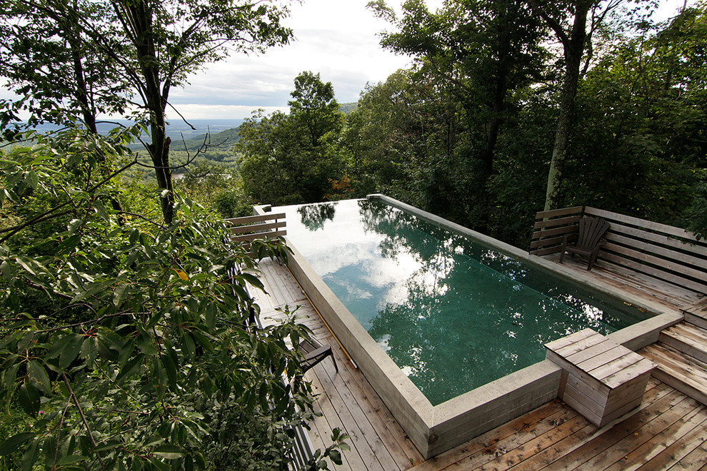 Inspiration for a contemporary pool in Montreal with decking.