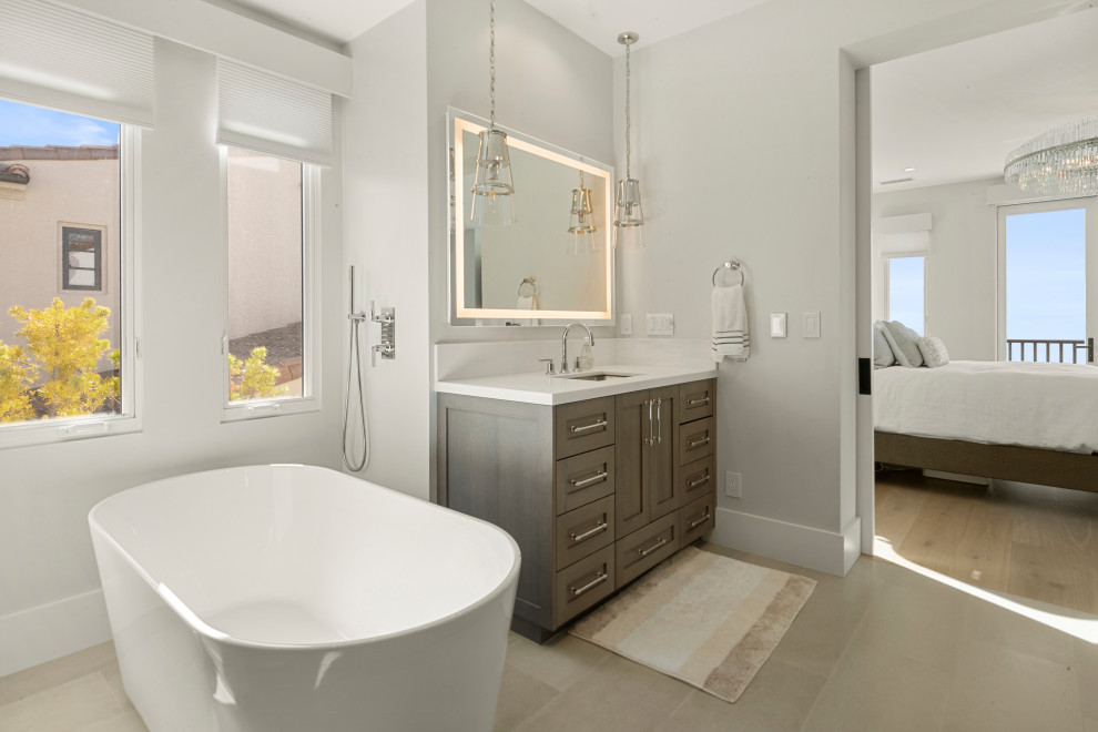 Inspiration for a mid-sized coastal 3/4 white tile and mosaic tile marble floor, gray floor and single-sink bathroom remodel in San Diego with open cabinets, brown cabinets, gray walls, an undermount sink, marble countertops and a freestanding vanity