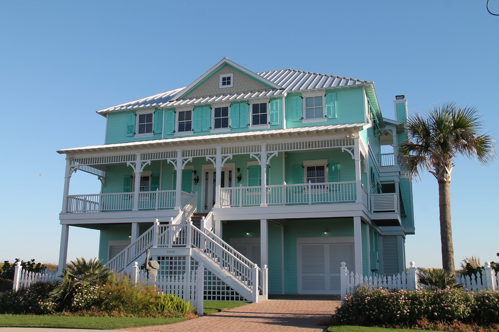 Photo of an expansive beach style three-storey exterior in Houston.