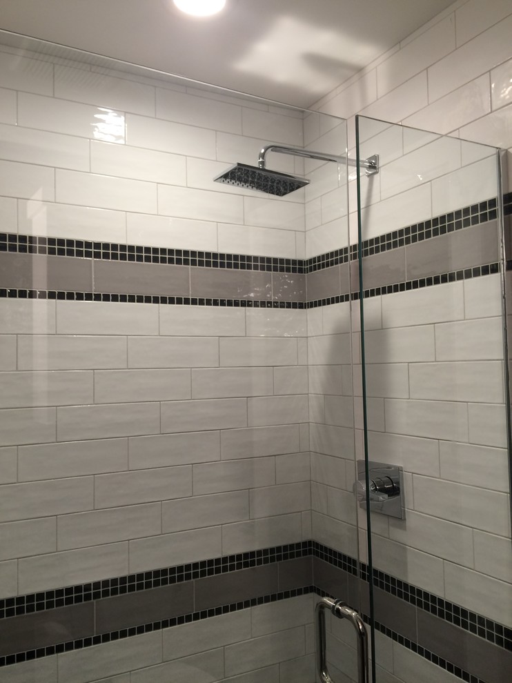 Example of a small transitional master white tile and cement tile porcelain tile alcove shower design with shaker cabinets, dark wood cabinets, black walls, an undermount sink and granite countertops